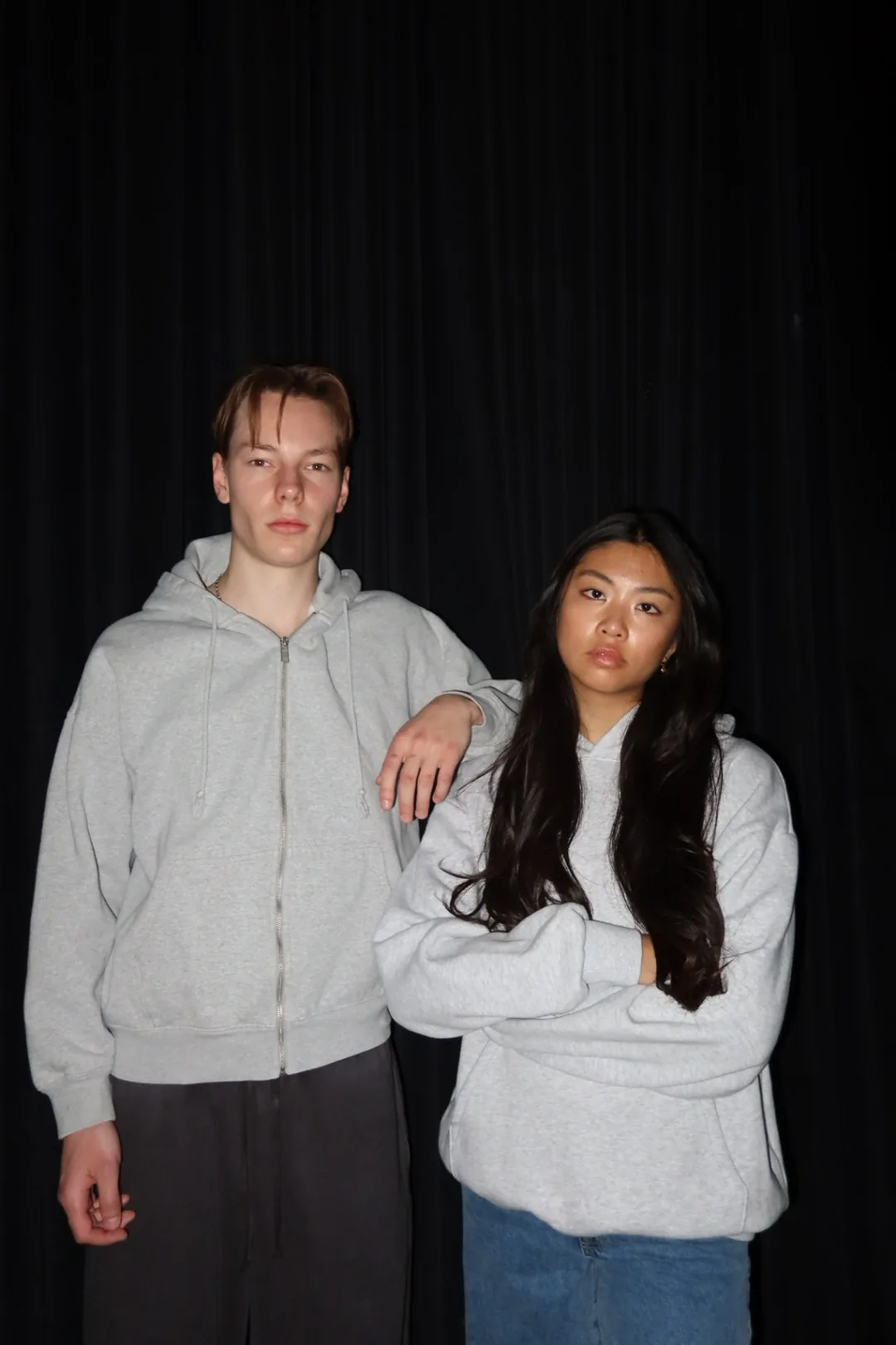 Grey zip hoodie and cream hoodie styled together